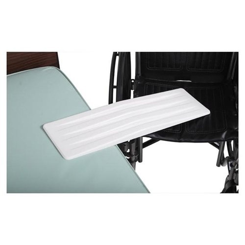 A transfer board joining a bed and a wheelchair.