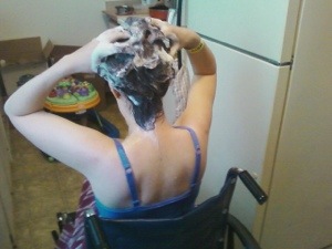 me from the back, in the wheelchair, scrubbing my hair.
