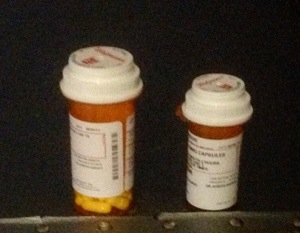 two pill bottles on a table