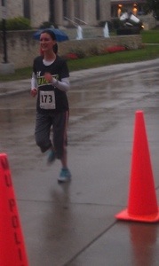 Michaela crossing the 5K finish line